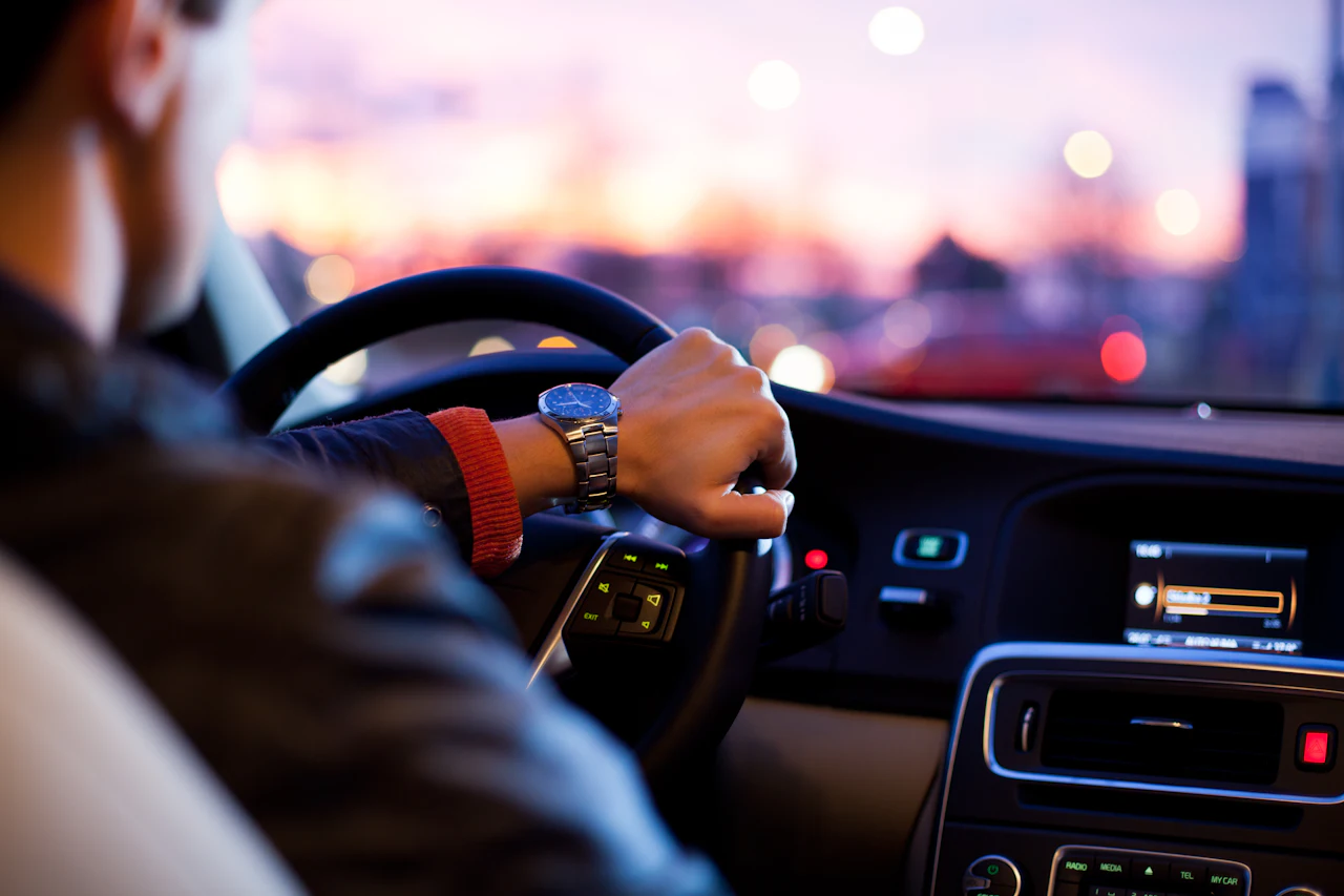 Driver’s view from the wheel of a taxi at dusk