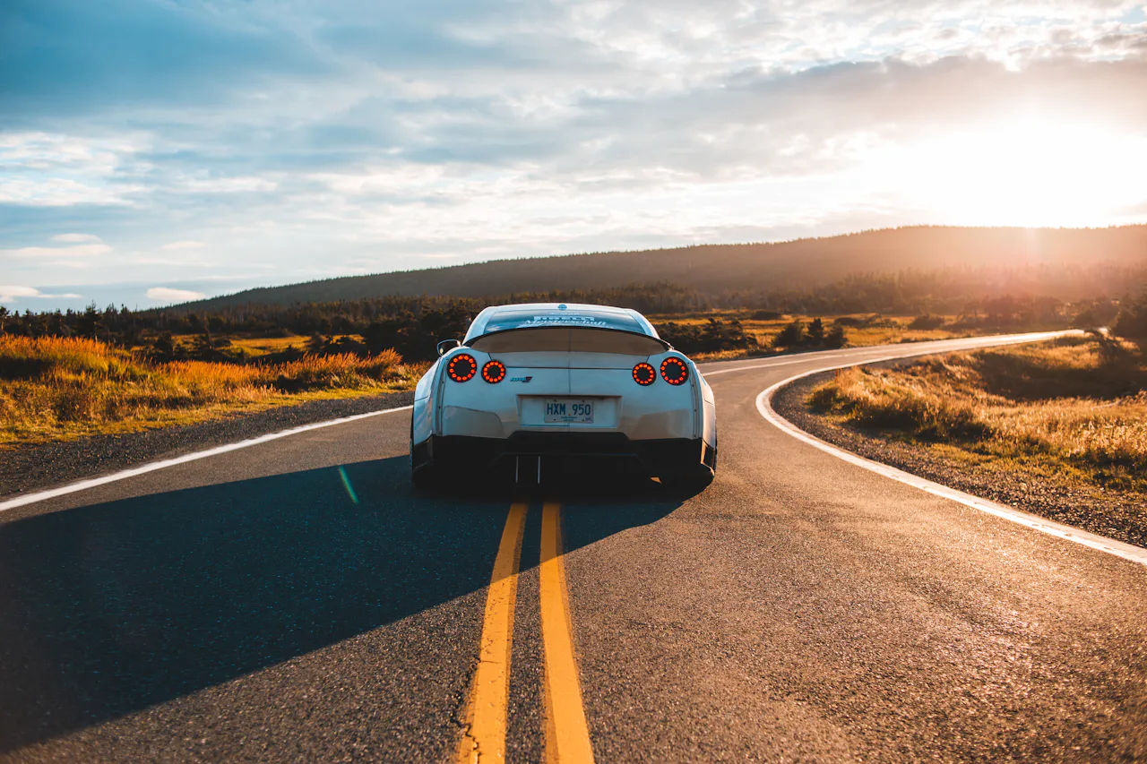 Open road stretching toward the horizon at sunset